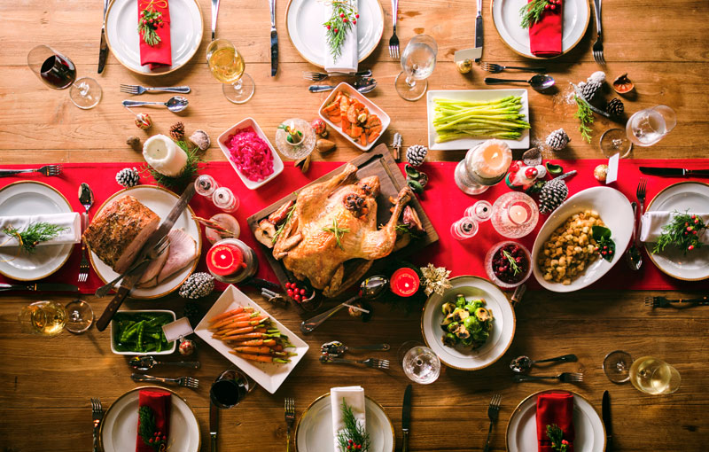 Holiday table spread with decor and food