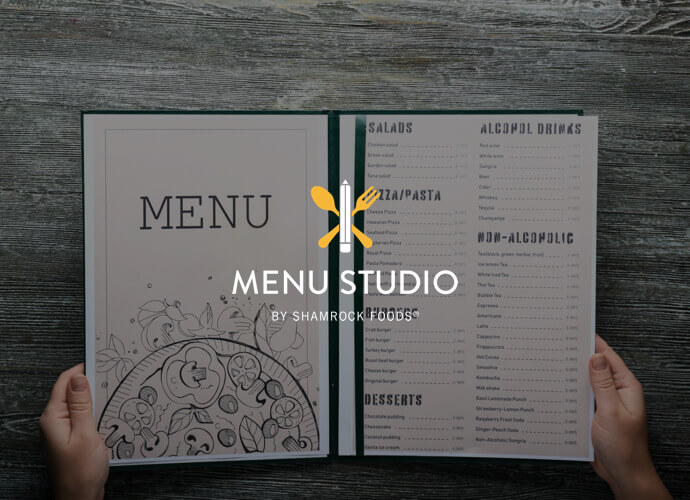 Hands holding restaurant menu behind Menu Studio log